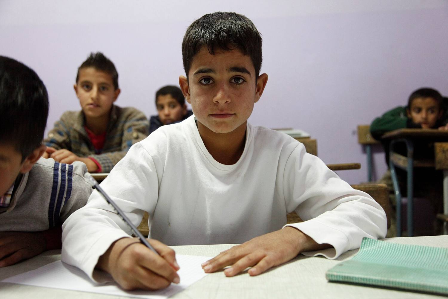 A pupil at a school serving families displaced by conflict